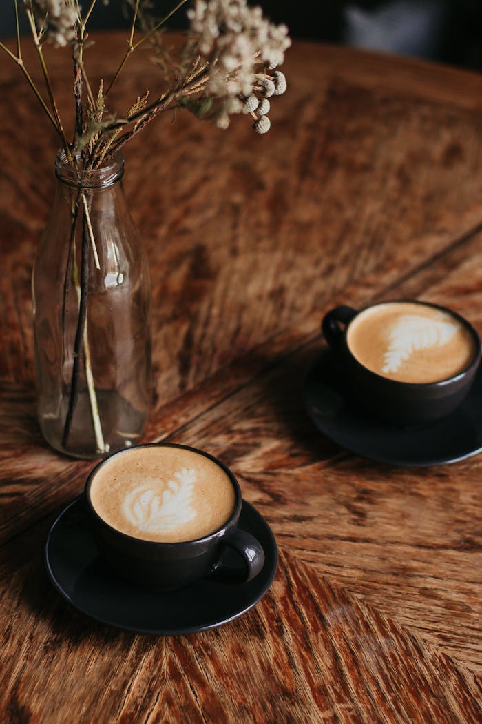 Two Cups Of Coffee On Table